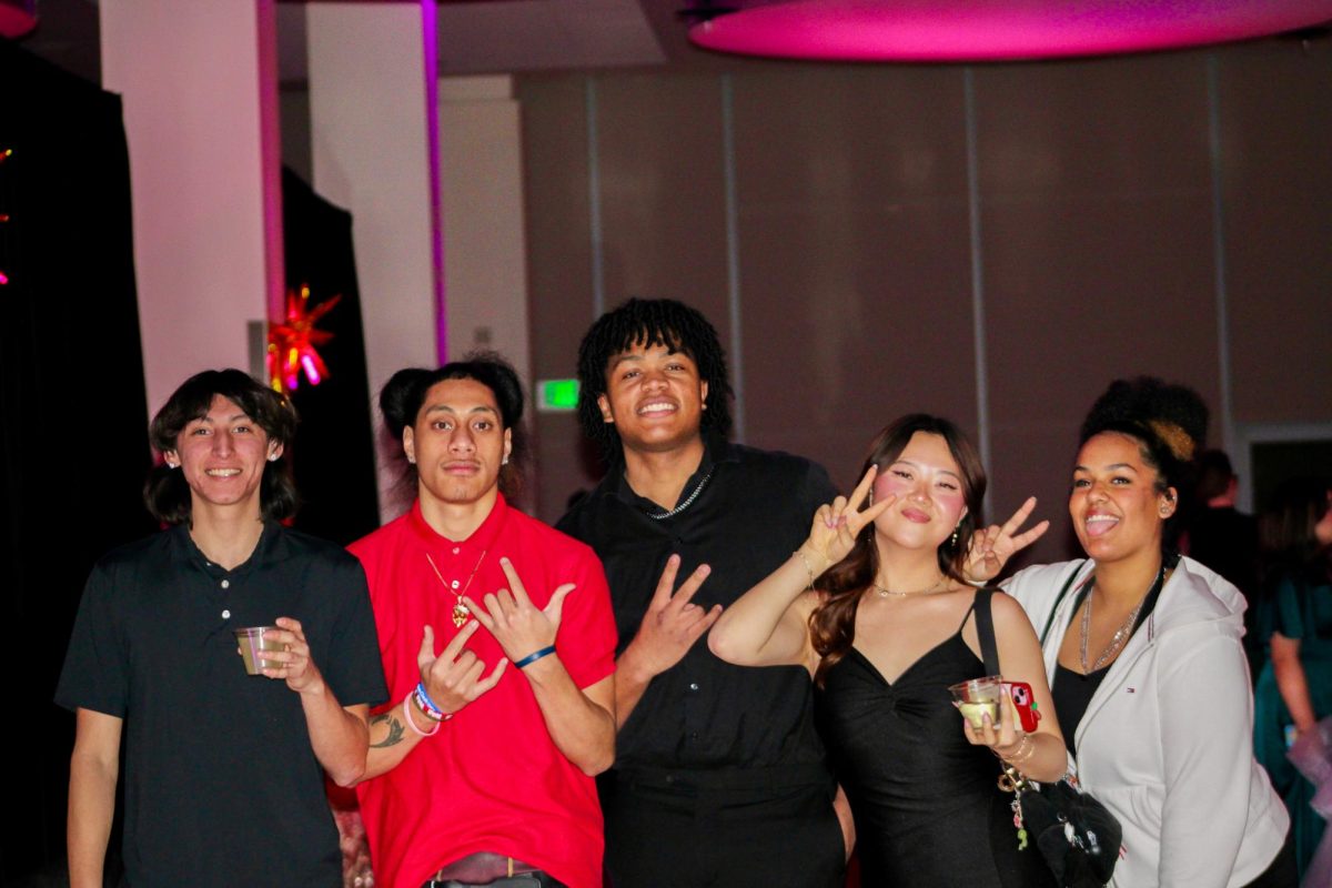 Attendees posing for a group photo at the BSU/SEB Masquerade Ball, Jan. 17, 2026