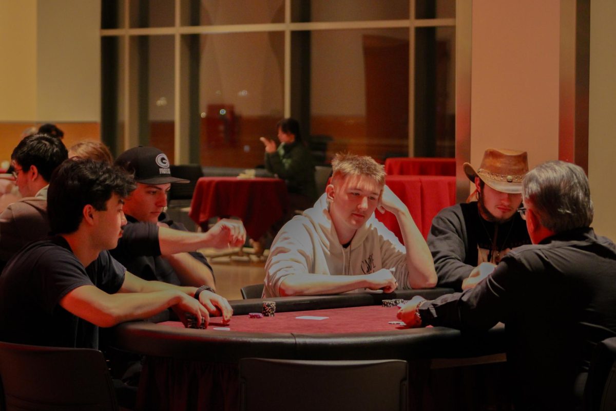 Attendees sit around card game tables at SEB's Up All Night Casino Night, Jan. 30, 2026.
