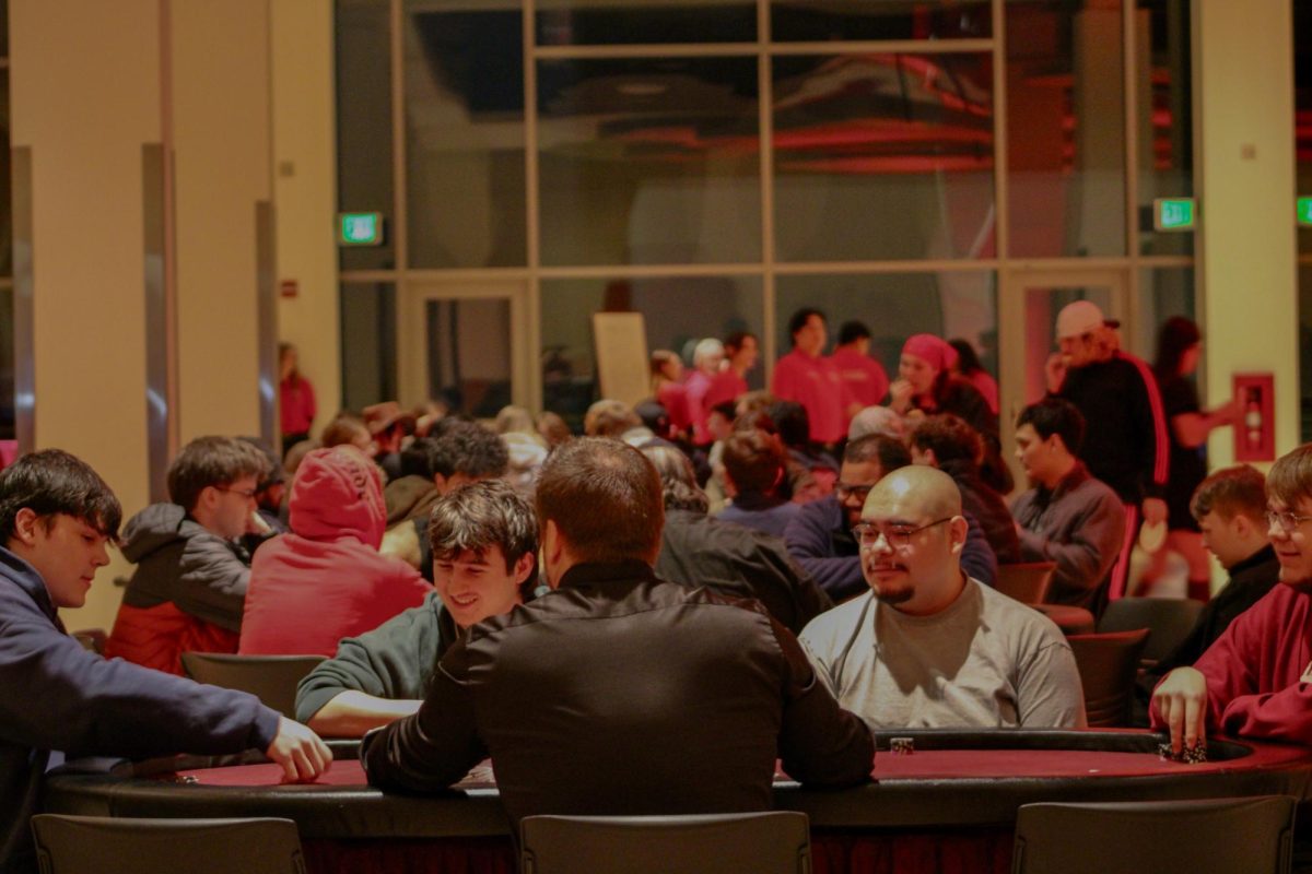 Attendees sit around card game tables at SEB's Up All Night Casino Night, Jan. 30, 2026.