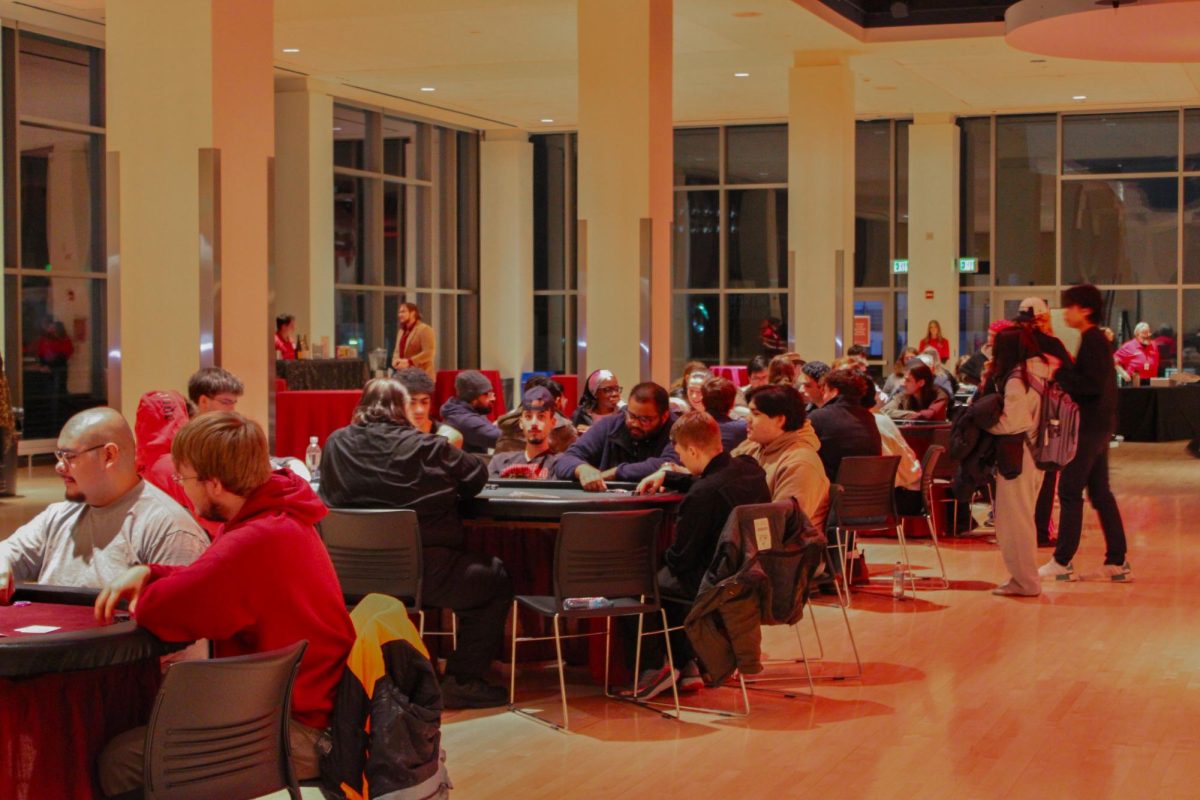 Attendees sit around card game tables at SEB's Up All Night Casino Night, Jan. 30, 2026.