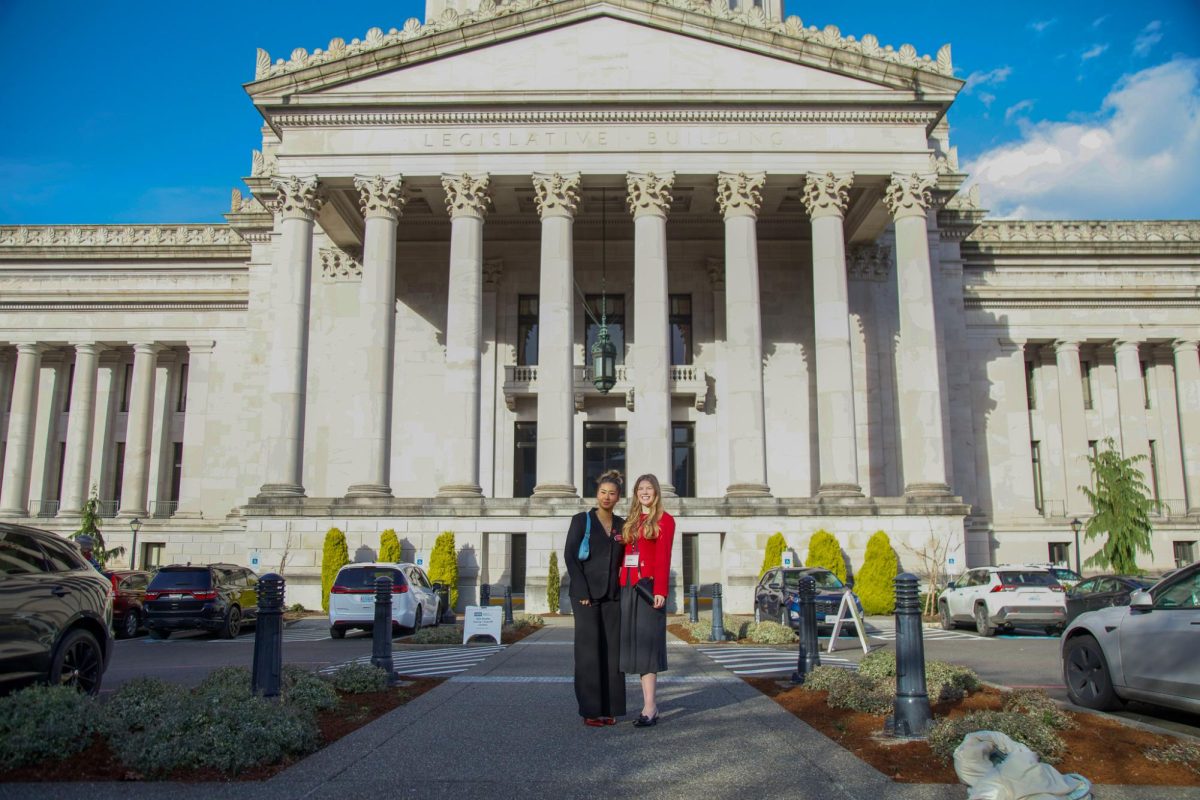 ASWSU Director of University Affairs Katelyn Moriwaki and Director of Community Affairs Kelsi Thoren in from of the Washington State Capitol building, Jan. 26, 2026.