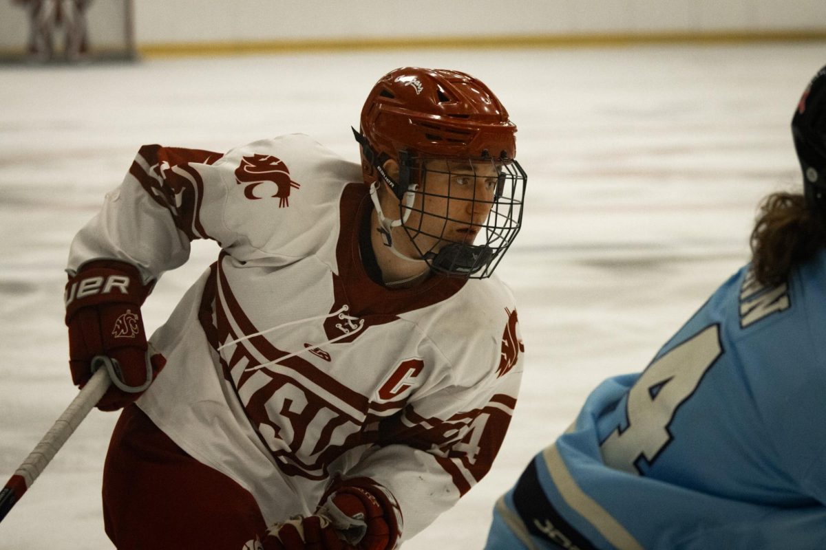 Cole Carlson skates into a play against the Western Washington hockey team on Jan. 18 2026. 