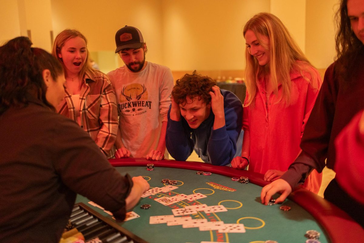 Attendees sit around card game tables at SEB's Up All Night Casino Night, Jan. 30, 2026.