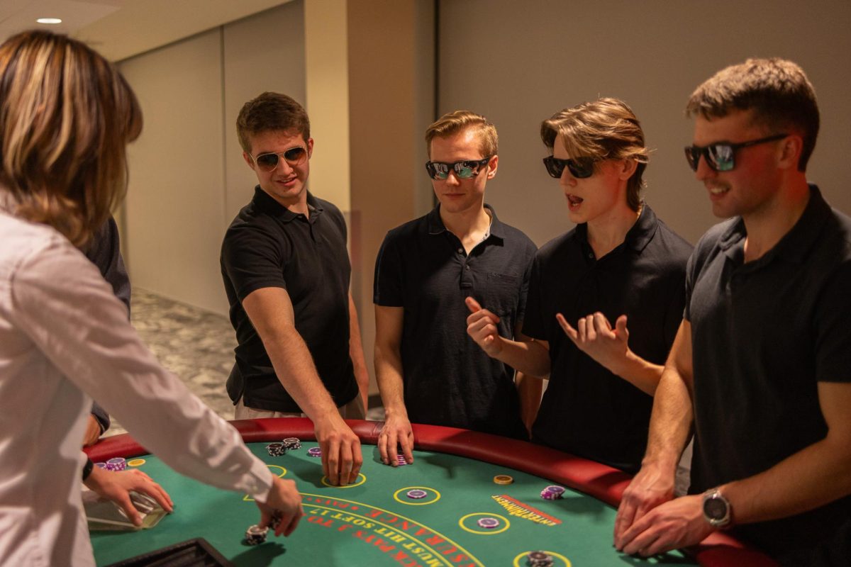 Attendees sit around card game tables at SEB's Up All Night Casino Night, Jan. 30, 2026.