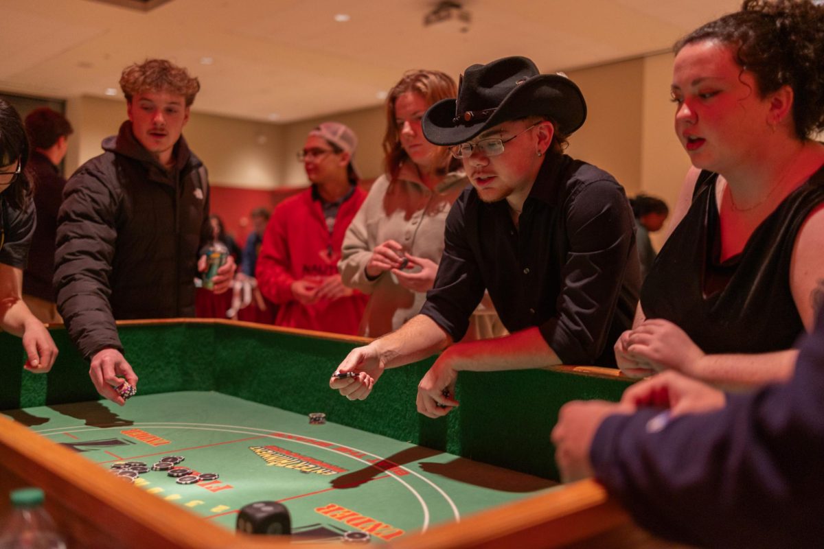 Attendees sit around card game tables at SEB's Up All Night Casino Night, Jan. 30, 2026.