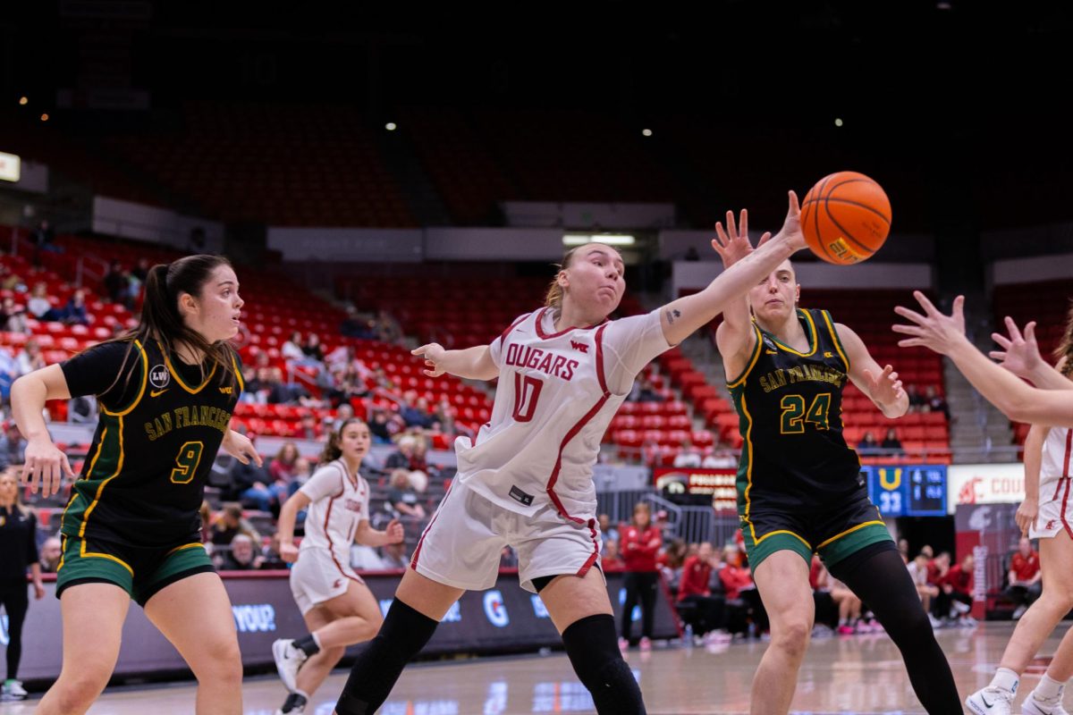 WSU Guard Charlotte Abraham reaches to intercept a pass against University of San Francisco players, Jan. 17, 2026