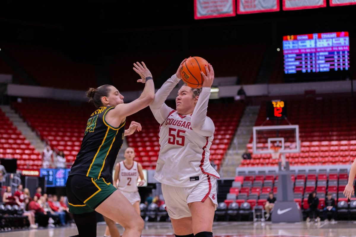 WSU Forward Malia Ruud looks for an opening against University of San Francisco Forward Sol Castro, Jan. 17, 2026