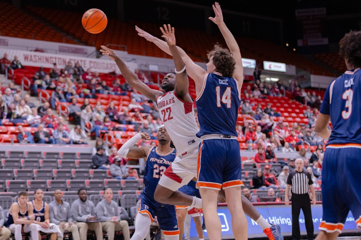 WSU Forward ND Okafor fights for the ball against Pepperdine University Center Stefan Cicic, Jan. 24, 2026.