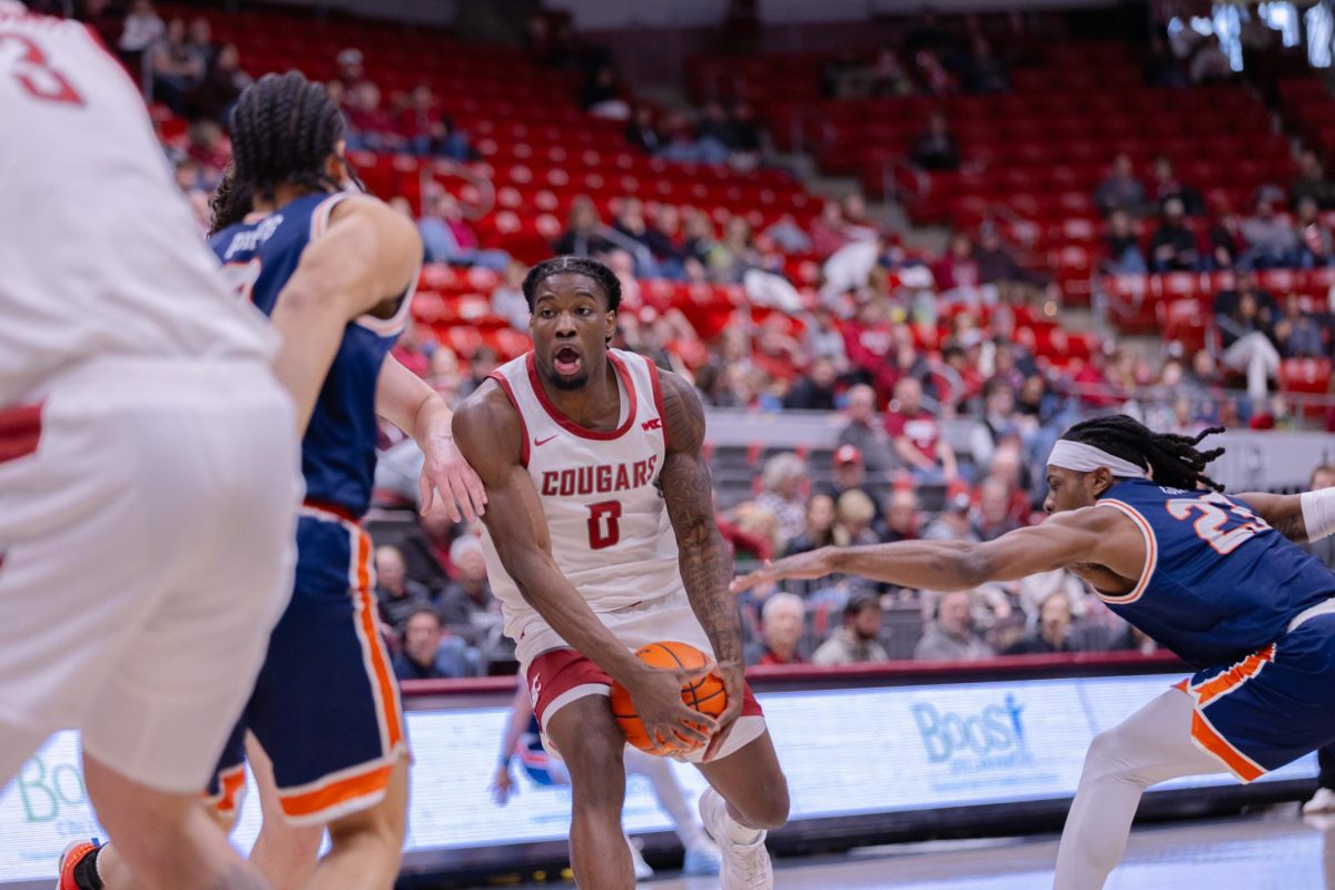 WSU Forward Emmanuel Ugbo under defense by Pepperdine University, Jan. 24, 2026.