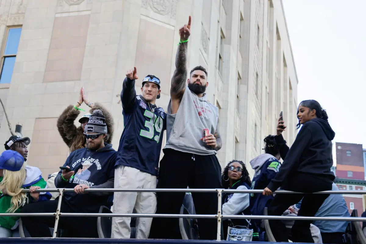 Former Coug Abraham Lucas celebrating the Seahawks Super Bowl win in 2026 during the parade procession in downtown Seattle (Courtesy of John Froschauer). 