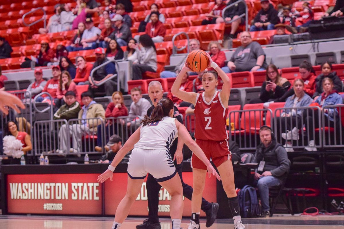 WSU Guard Eleonora Villa looking to pass the ball with Gonzaga Guard Inês Bettencourt guarding her, Jan. 31, 2026.