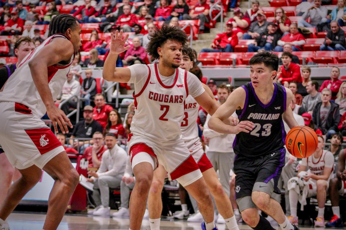 WSU Forward Eemmeli Yalaho guarding against Portland Guard Joel Foxwell, Jan. 31, 2026.