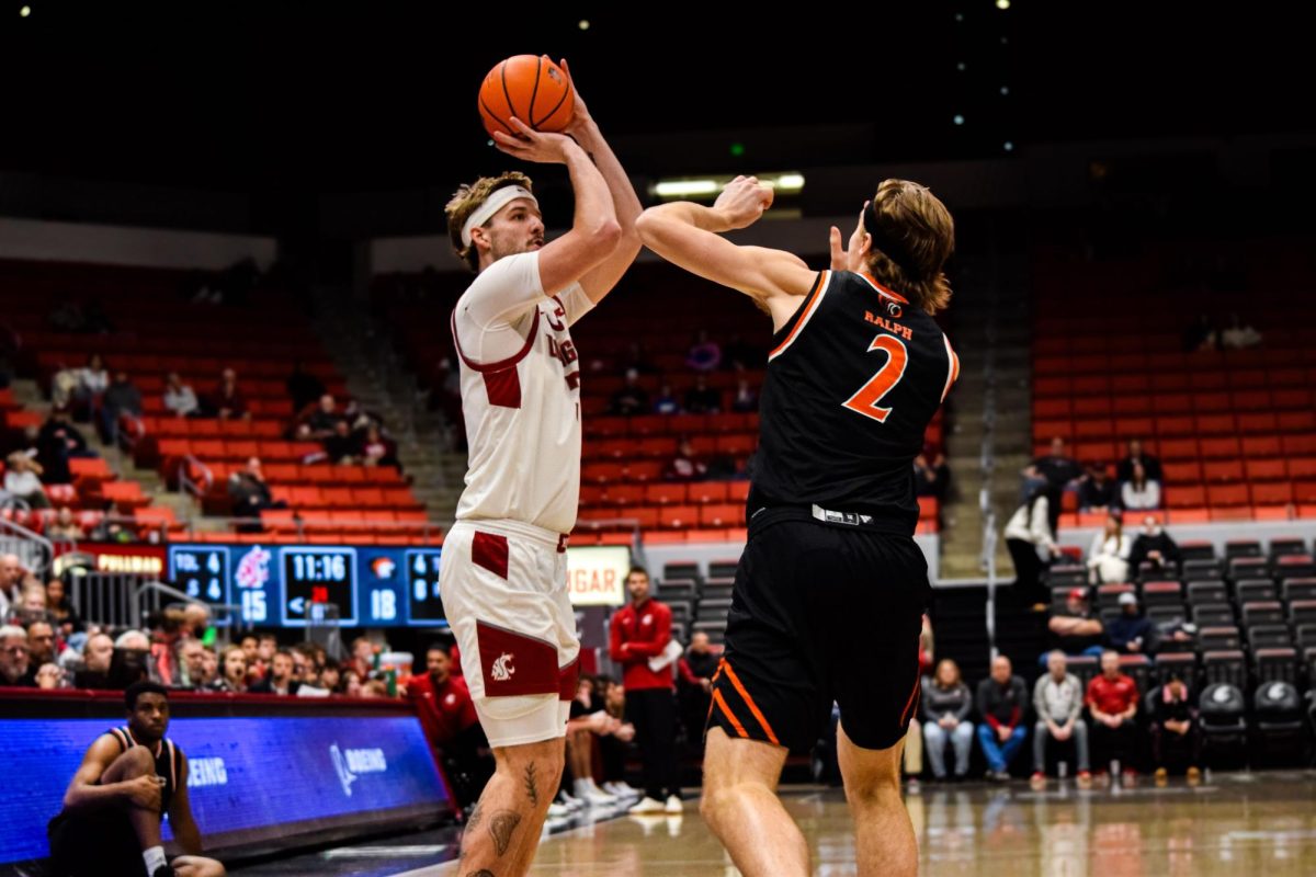 Simon Hildebrandt takes a shot, being defended against Pacific’s Elias Ralph on Feb. 18, 2026, Pullman, WASH 