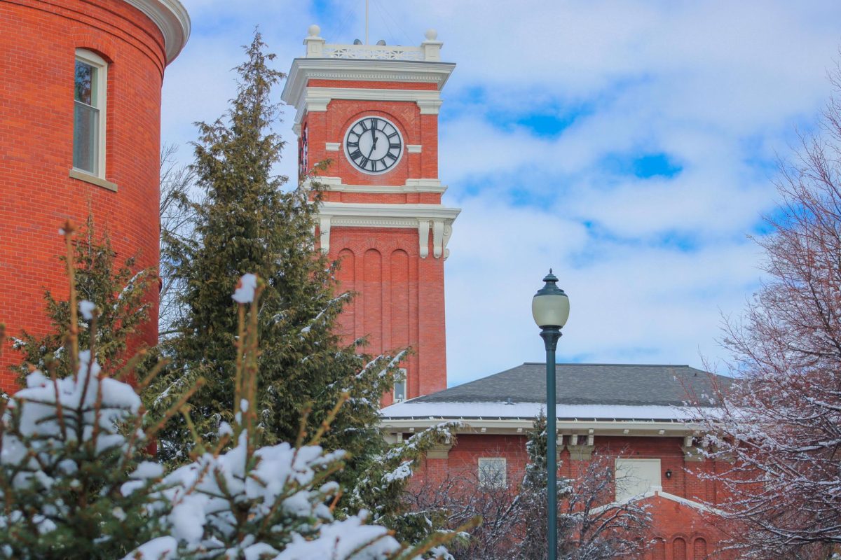 Snowy trees and rooftops surrounding the Bryan Hall clock tower on the WSU Pullman campus, Feb. 17, 2026.