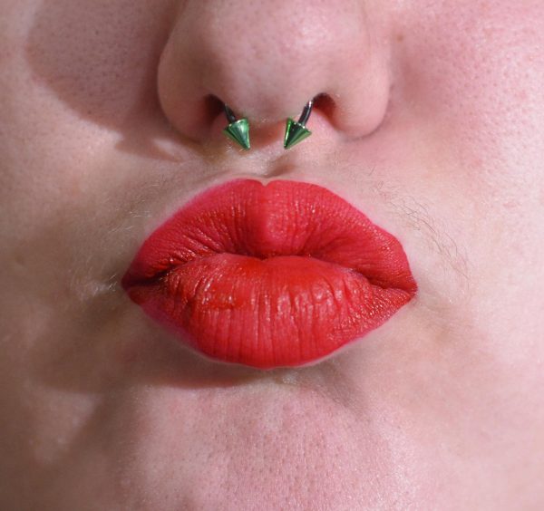 A student purses their lips as if for a kiss, Feb. 10, 2026.
