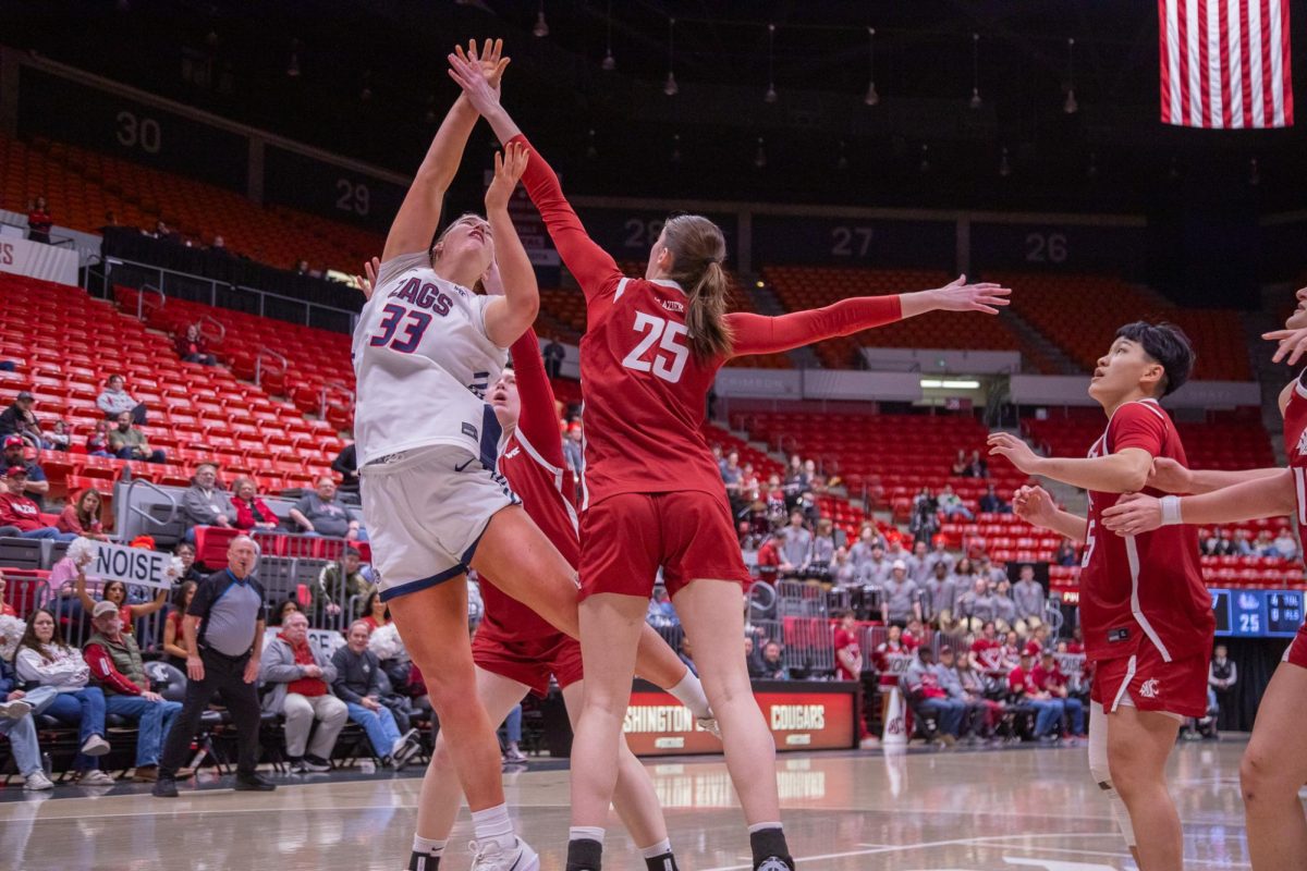 WSU Forward Lauren Glazier reaches to block the ball against Gonzaga University, Jan. 31, 2026.