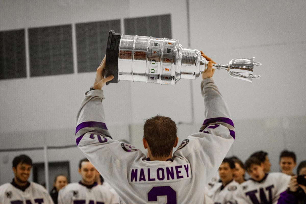 Logan Maloney hoisting the Pac-8 championship trophy after the 2026 Pac08 playoffs on Feb. 8 2026 in Cheney. 