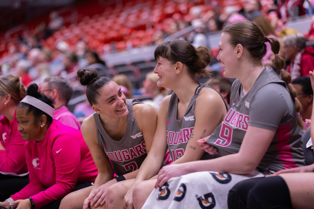 Eleonora Villa (2), Marta Alsina (12), and Tanja Valancic (9) cheering on their team from the sidelines against Seattle University, Feb. 26, 2026.