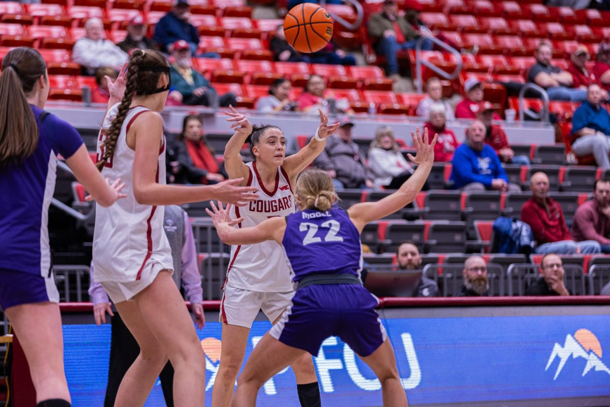 WSU Guard Eleonora Villa throws a pass through University of Portland's defense, Feb. 12, 2026.