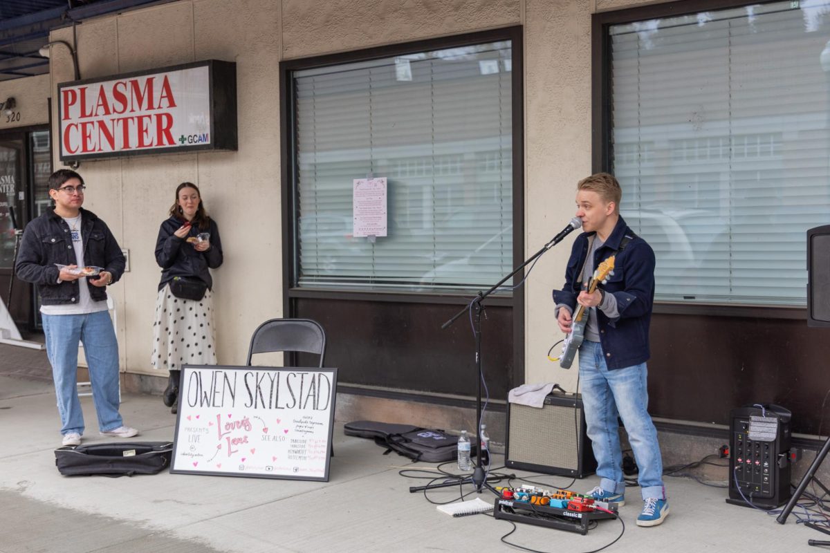 Owen Skylstad performing outside Identity Salon during Promote Pullman's Lover's Lane event, Feb. 14, 2026.