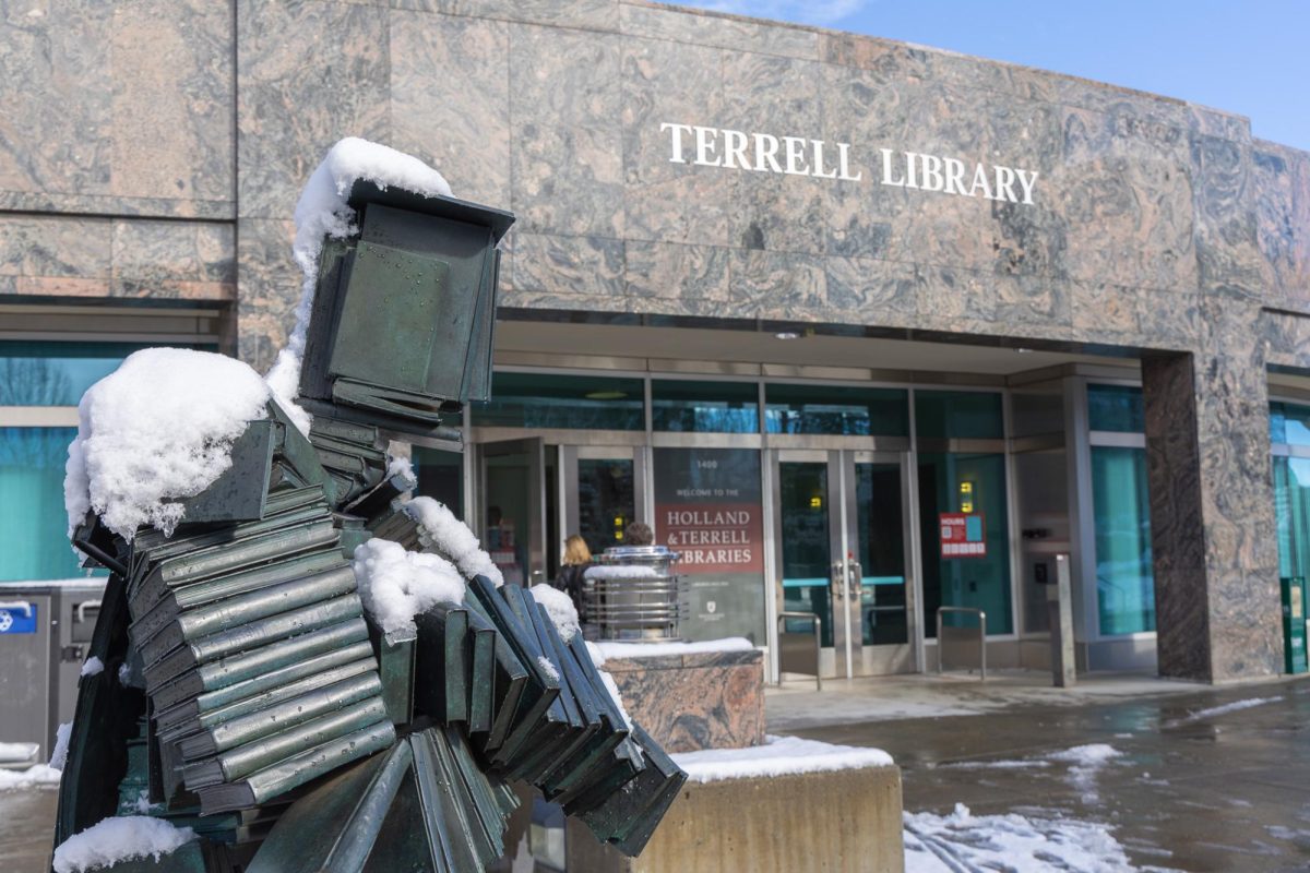 The snow-covered Bookin' statue outside Terrell Library, Feb. 17, 2026.