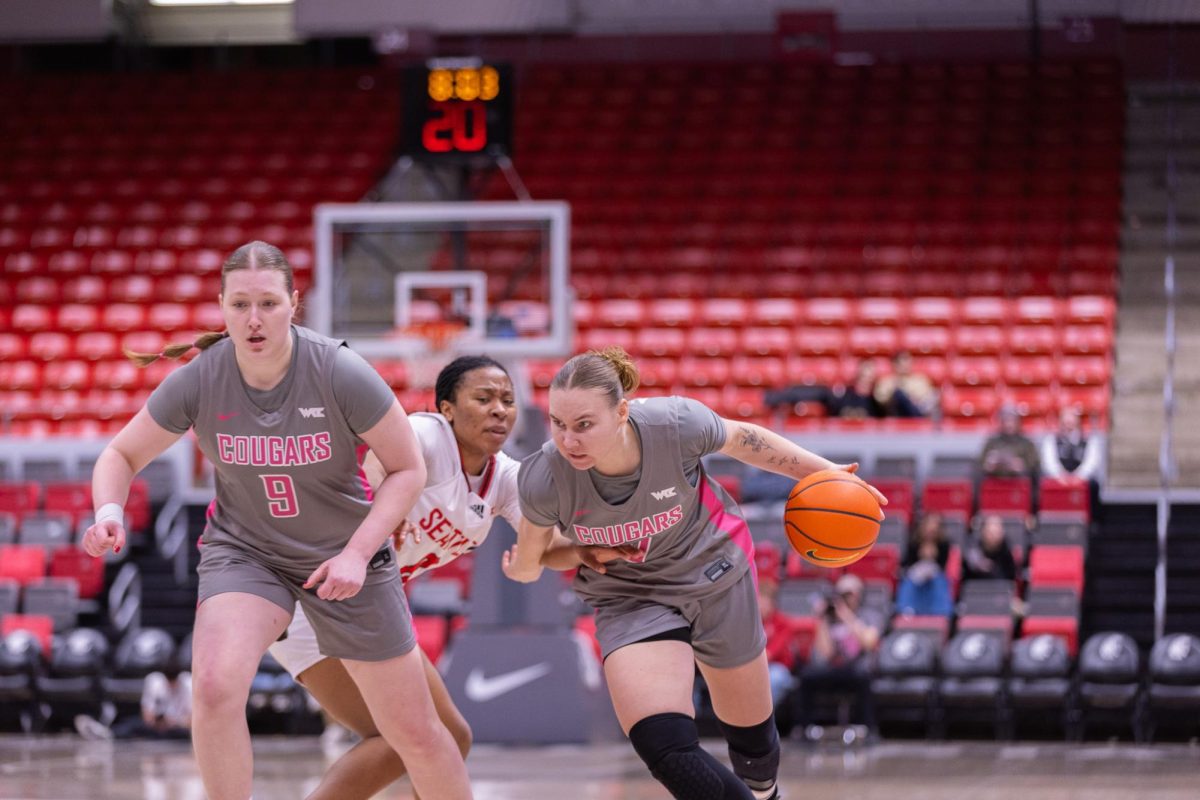 WSU Guard Charlotte Abraham pushing past Seattle University Guard Chloe Emanga, Feb. 26, 2026.