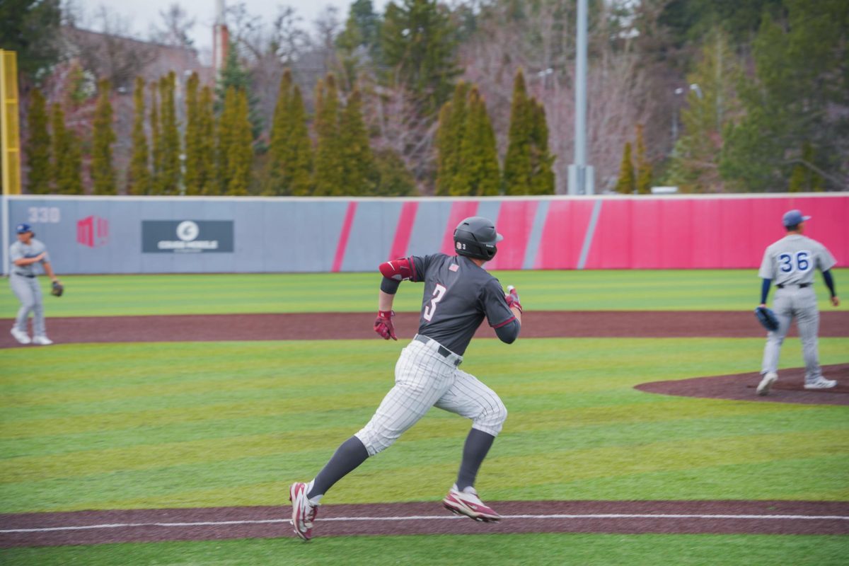 WSU outfielder Matt Priest sprints to first base after a hit against University of Nevada, March 28, 2026.