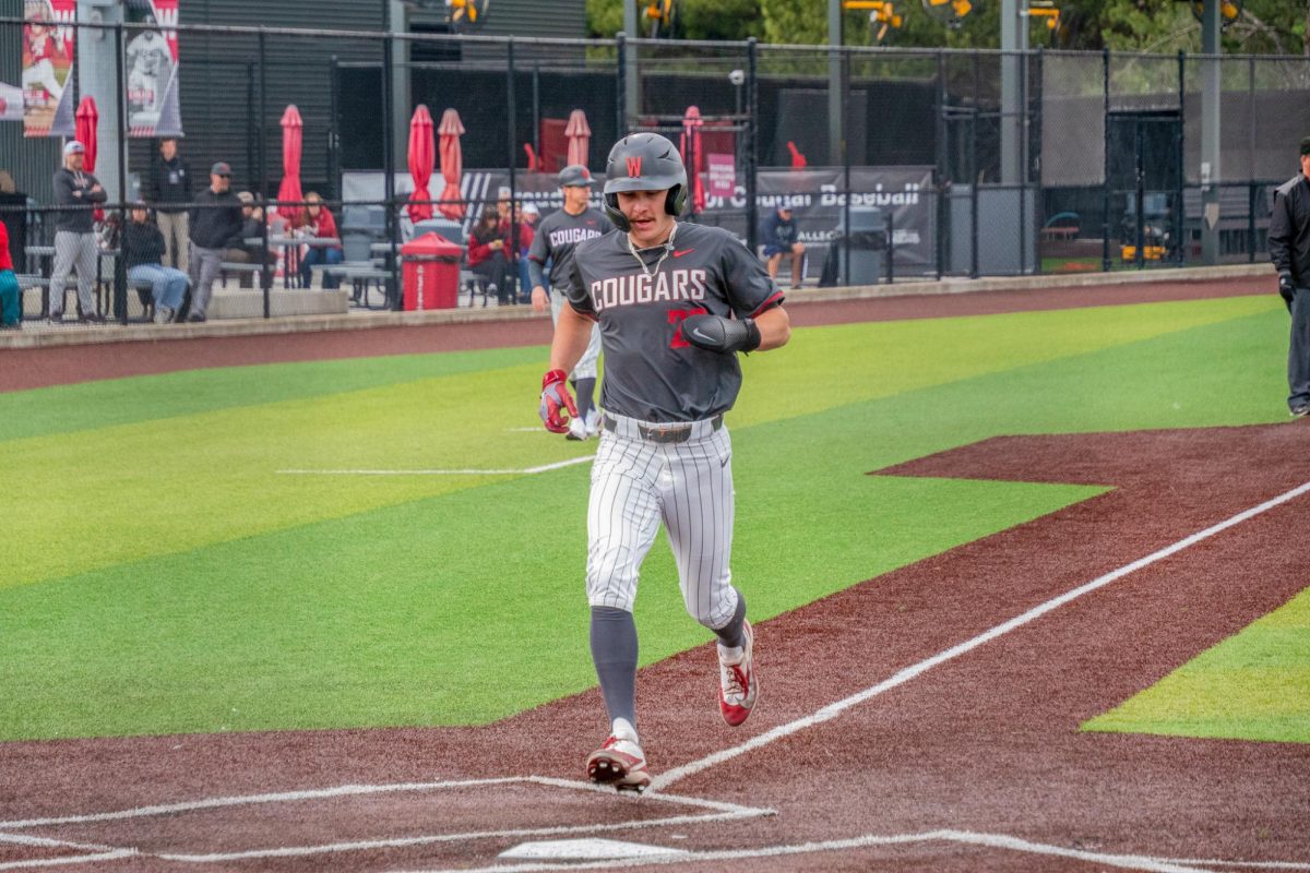 WSU outfielder Max Hartman running in for a score against University of Nevada, March 28, 2026.

