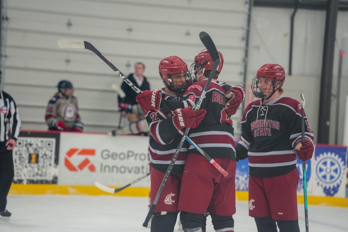 WSU forward David Bushkin and defender Lucas Robinson celebrate on the ice against Gonzaga, March 27, 2026.