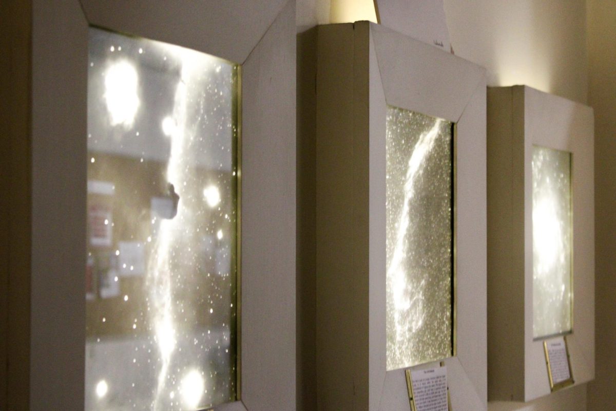 Images of nebulae, stars and galaxies hanging in the WSU Planetarium, March 25, 2026.
