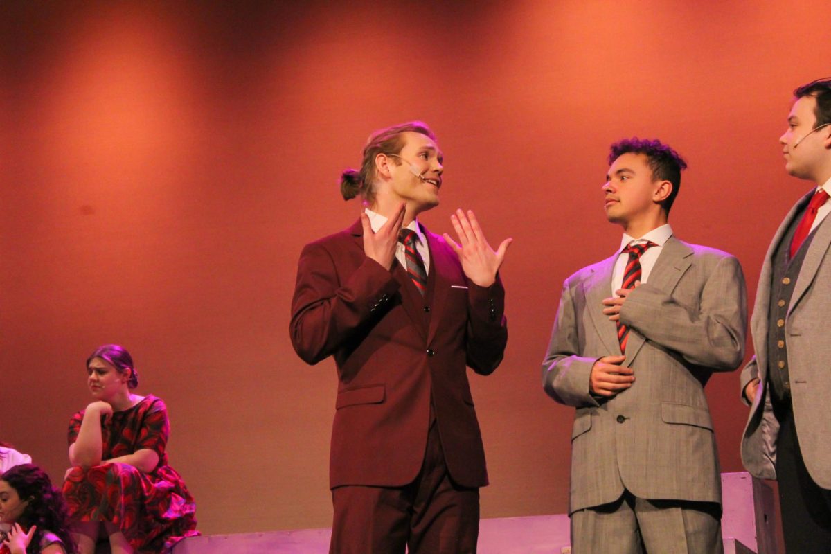 Andon Merrick looks at Manny Caldwell and Jack Murdock during a dress rehearsal for "Princess Ida" at Bryan Hall, March 30, 2026