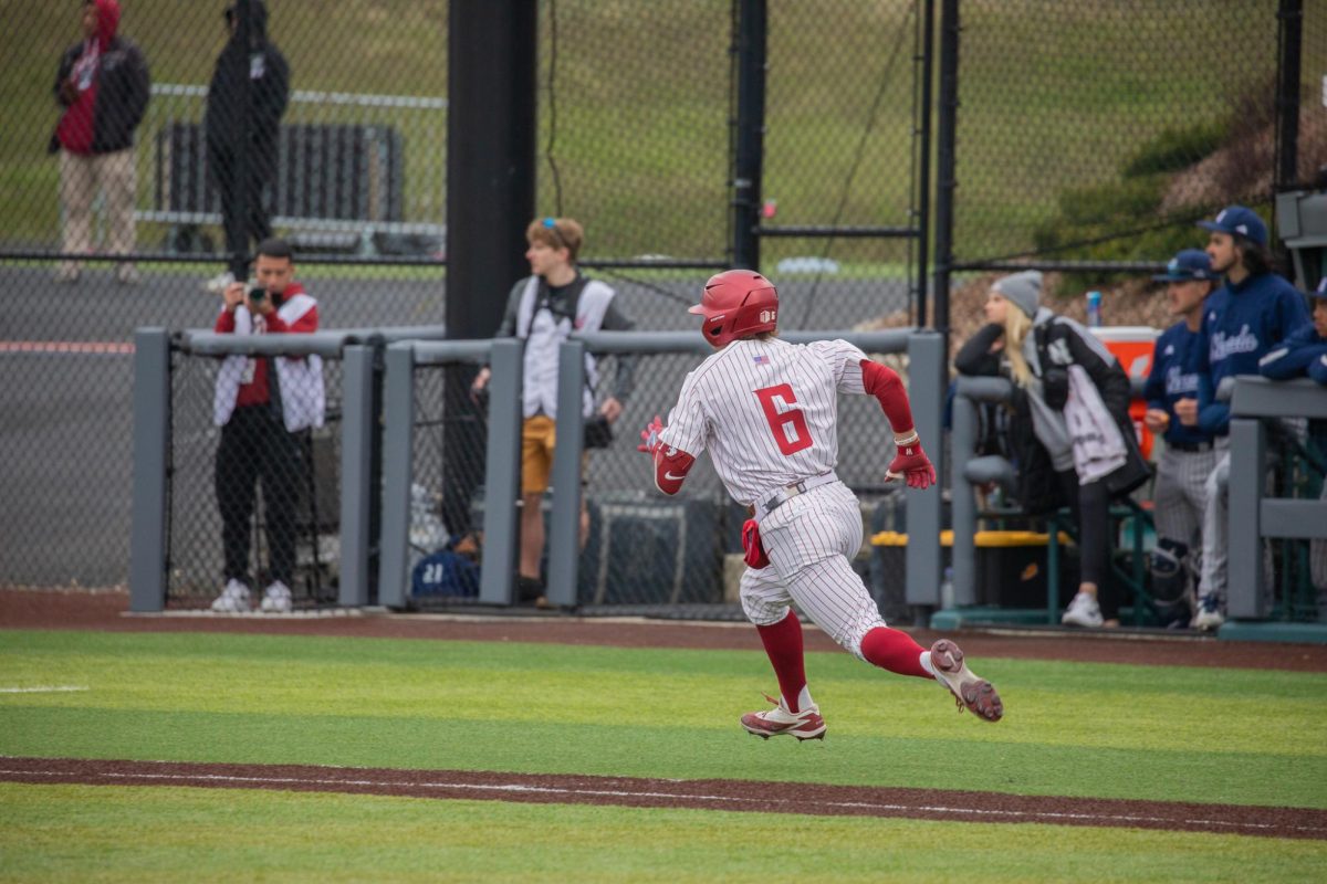 WSU Midfielder Gavin Roy running to first base against University of Nevada, March 29, 2026.