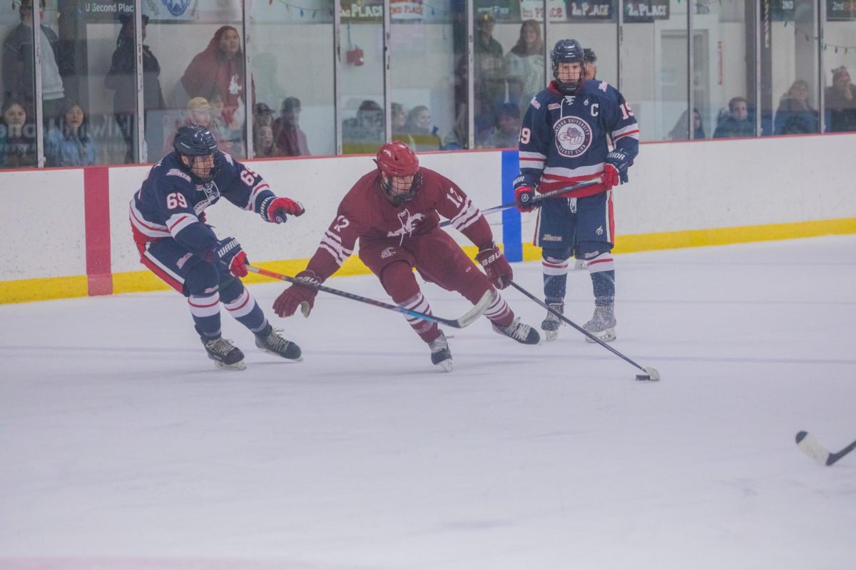 WSU hockey forward Max Lazzaro evading Gonzaga defense, March 27, 2026.