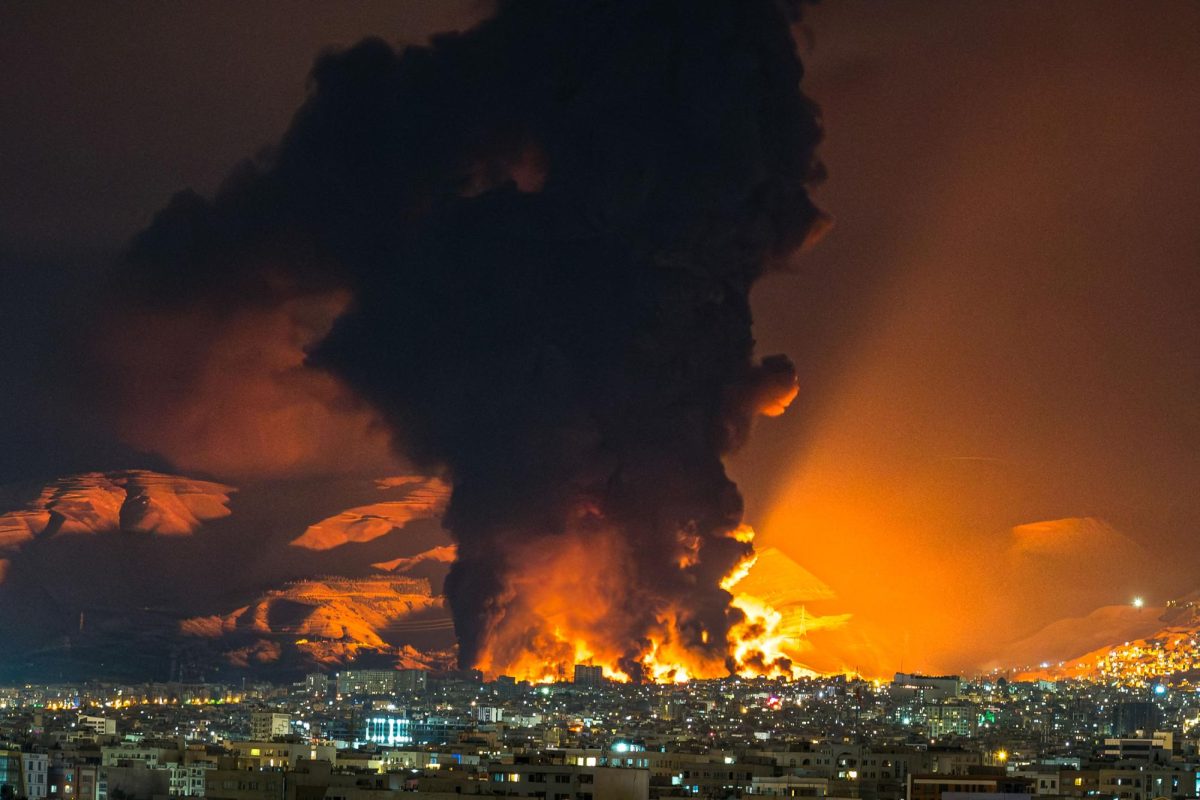 Smoke and flames rise at the site of airstrikes on an oil depot in Tehran on March 7, 2026. (Sasan/Middle East Images/AFP/Getty Images/TNS)
