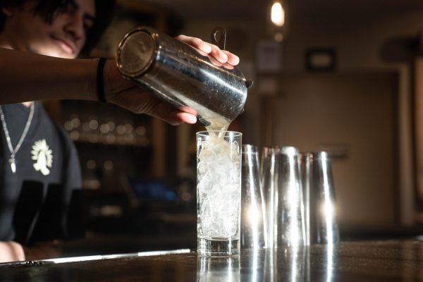 WSU student and bartender Sebastian Andrew-Nevarz mixes a drink at Namaste Indian Kitchen and Cocktails in downtown Pullman on Friday, Feb. 27. 