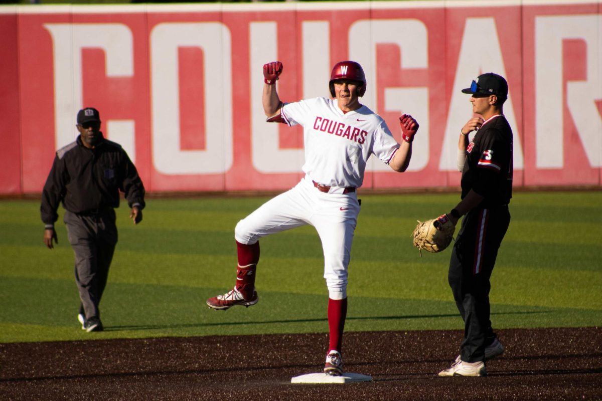 Dustin Robinson celebrates to the WSU baseball dugout after a double against Gardner-Webb on April 9 2026. 