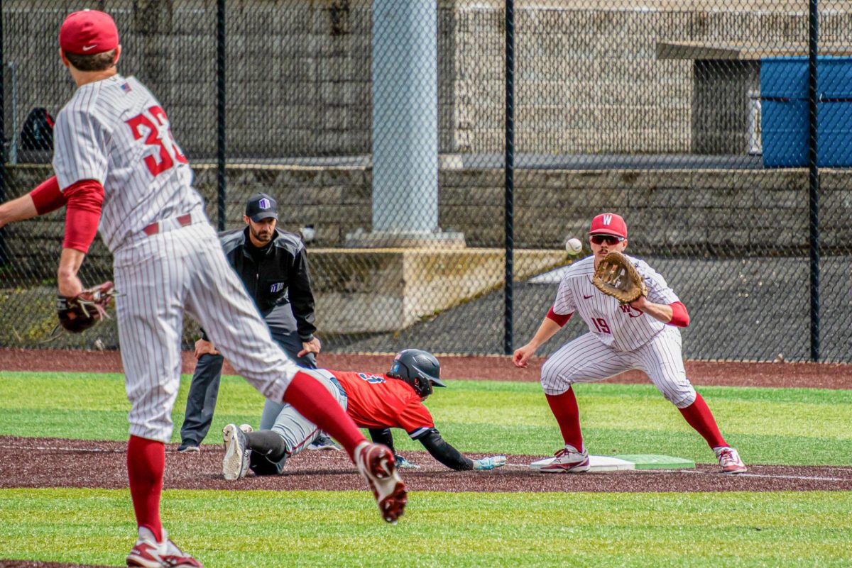 WSU Right-Handed Pitcher Luke Myers throws a pass to First Baseman Ryan Skjonsby for a pick-off attempt, April 11, 2026.
