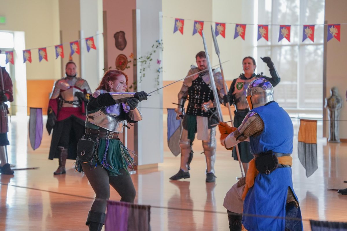 Performers battling in knightly garb at the SEB Re-Coug-Aissance Fair in the CUB, April 17, 2026.