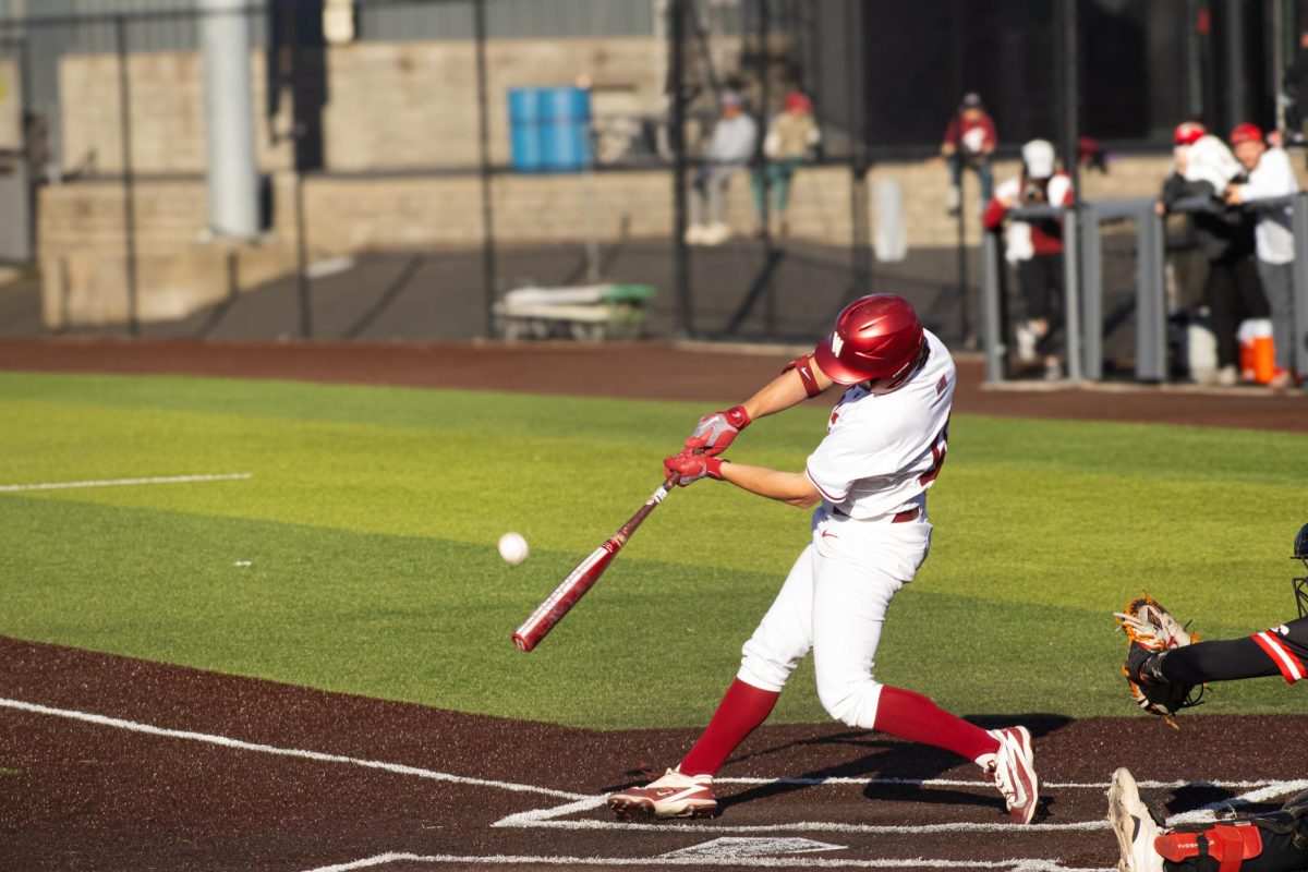 WSU catcher Noah Thein tees up a ball against the Gardner-Webb baseball team on April 9 2026. 