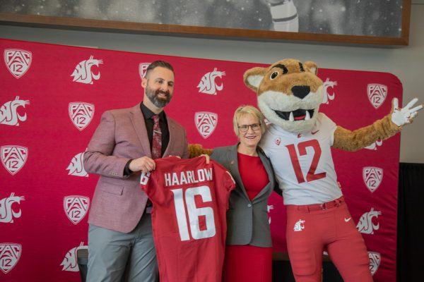 Newly appointed WSU Vice President and Director of Athletics Jon Haarlow, WSU President Elizabeth Cantwell and Butch T. Cougar pose for a photo, April 20, 2026.