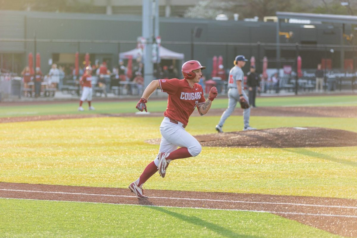 WSU Catcher Cam Macleod sprints to base against Gonzaga University, April 21, 2026.